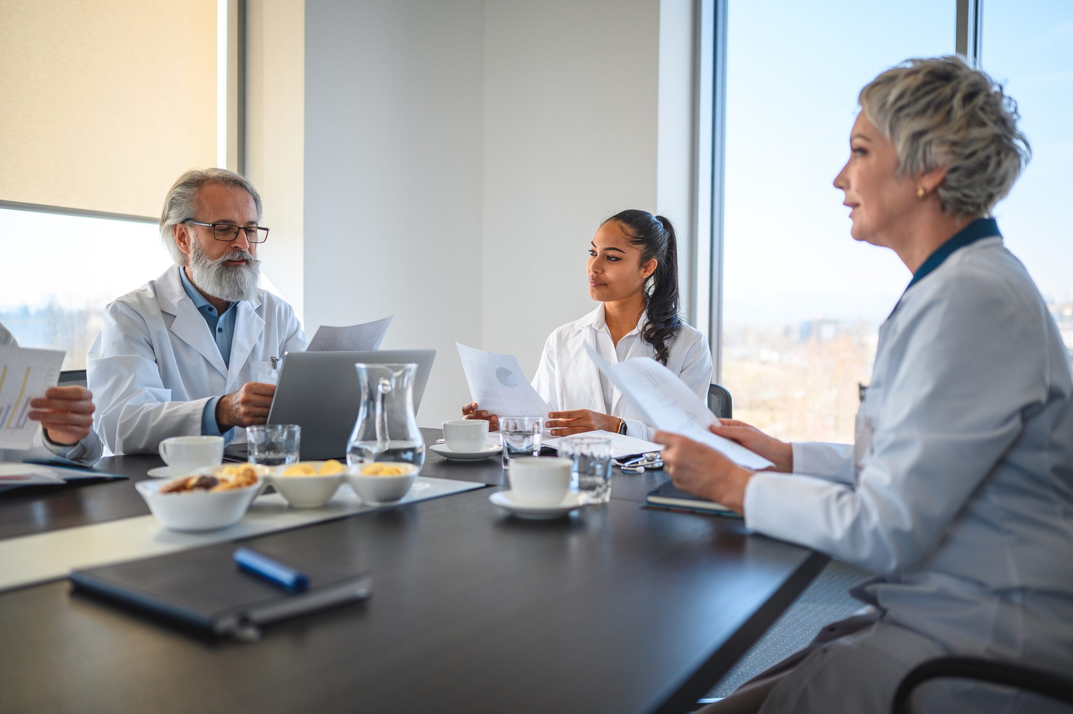 Staff Meeting at Modern Clinic, Medical Specialists are Talking