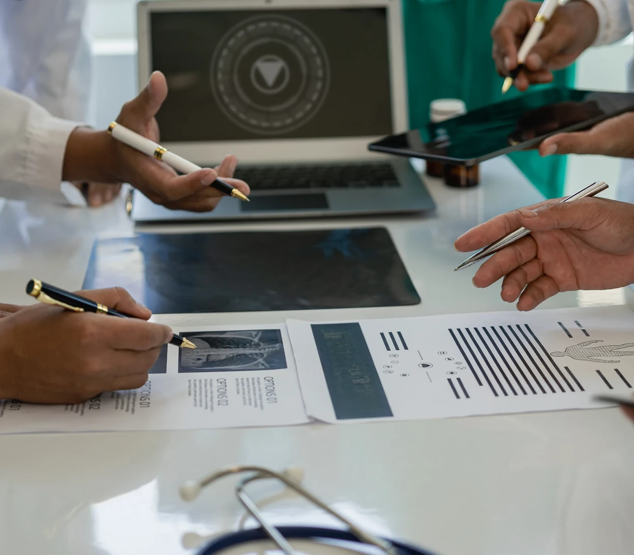 Healthcare professionals collaborating at desk